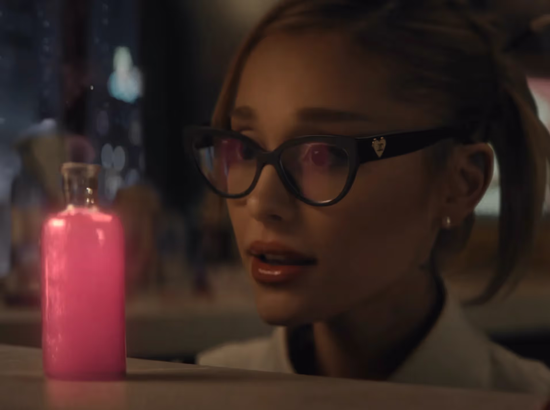 Ariana Grande makes a love potion to seduce Penn Badgley in 'the boy is mine' music video