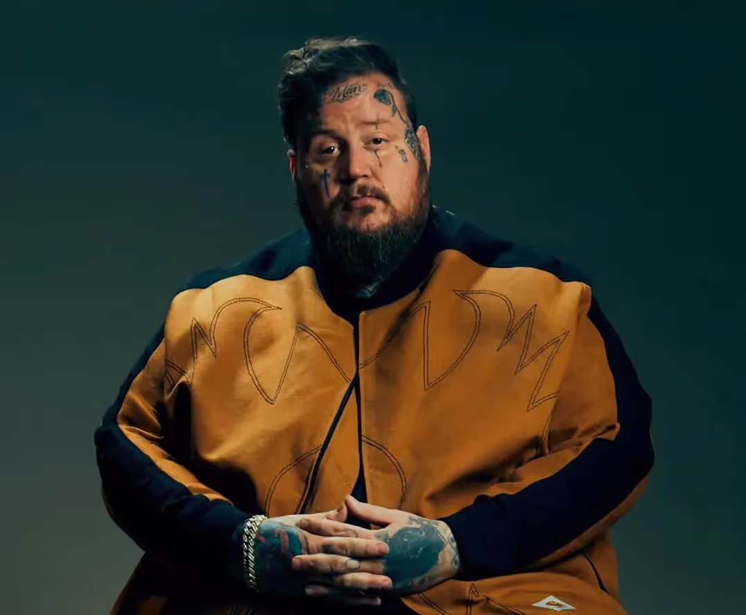 Jelly Roll for GQ, brown jacket, green background, RIAA Gold.