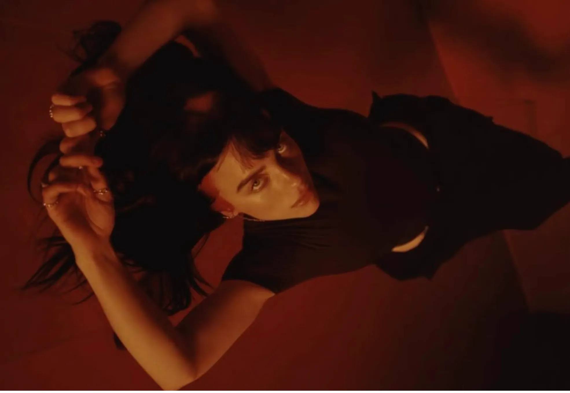 Billie Eilish with red hair in red room, in support of 'Eilish No. 3' perfume, released November 9, 2023