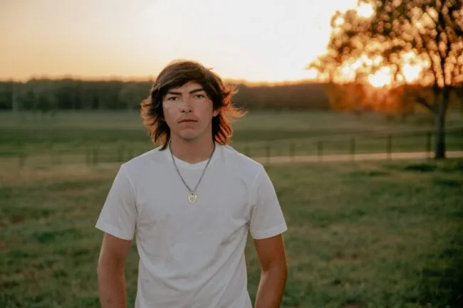 Wyatt Flores photo in a filed - Artist Bio