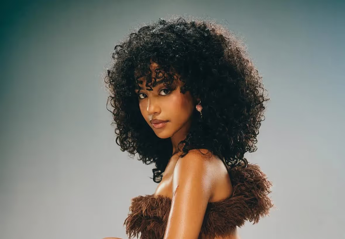 Tyla with natural curls, artist profile, 2024