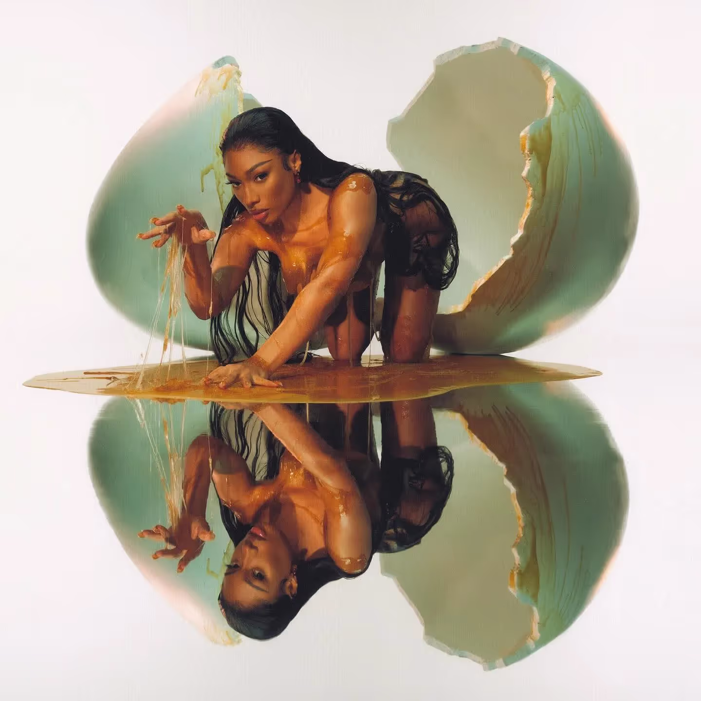 Megan Thee Stallion hatching from the egg on the cover of 'Megan' album.