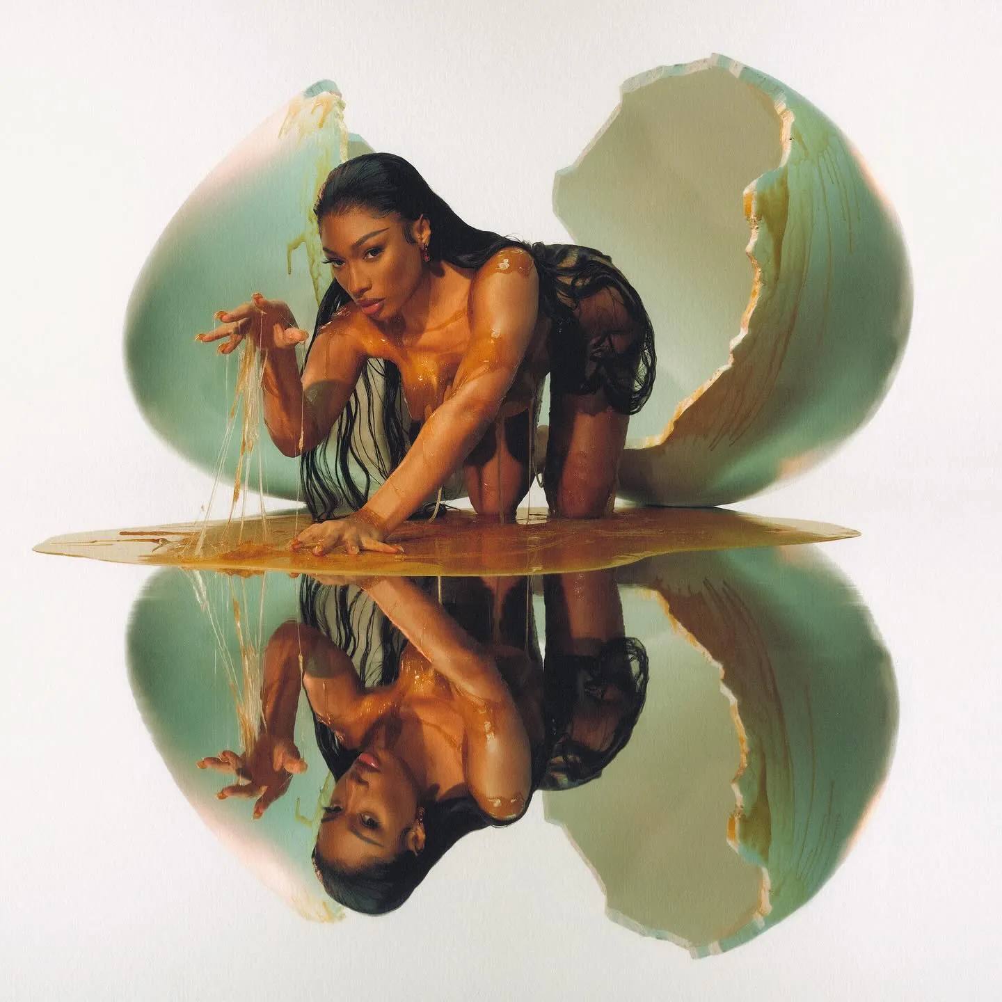 Megan Thee Stallion hatching from the egg on the cover of 'Megan' album.