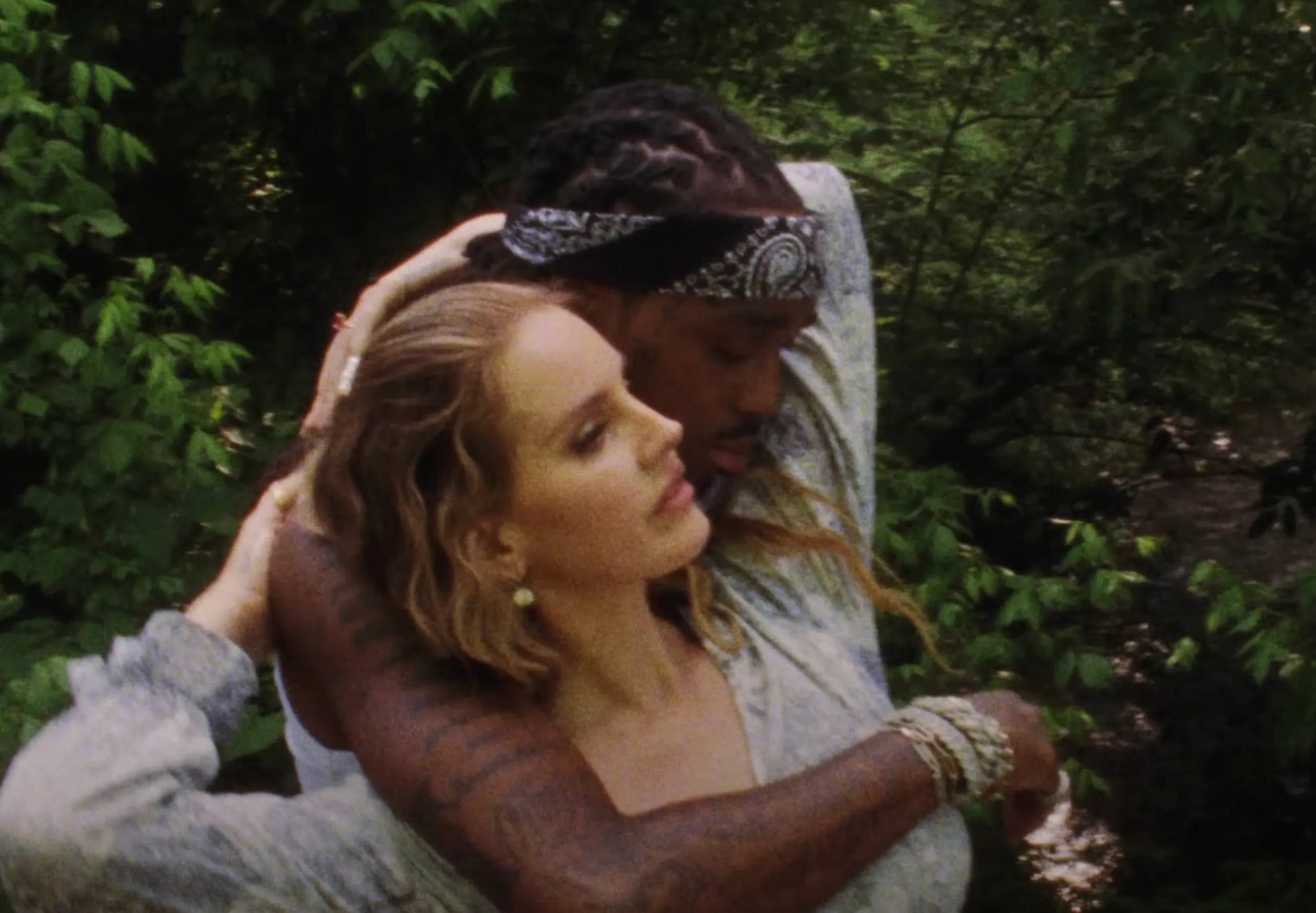 Lana Del Ret and Quavo cuddling in 'Tough' music video