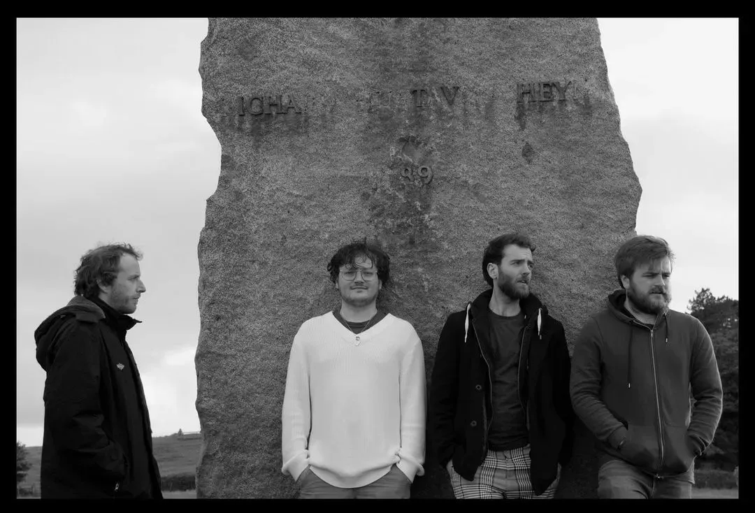 Von Loop - all our members by the rock, black and white