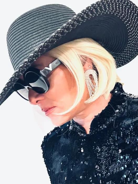 Riiver Brukes, black sparkling jacket, black hat, black sunglasses