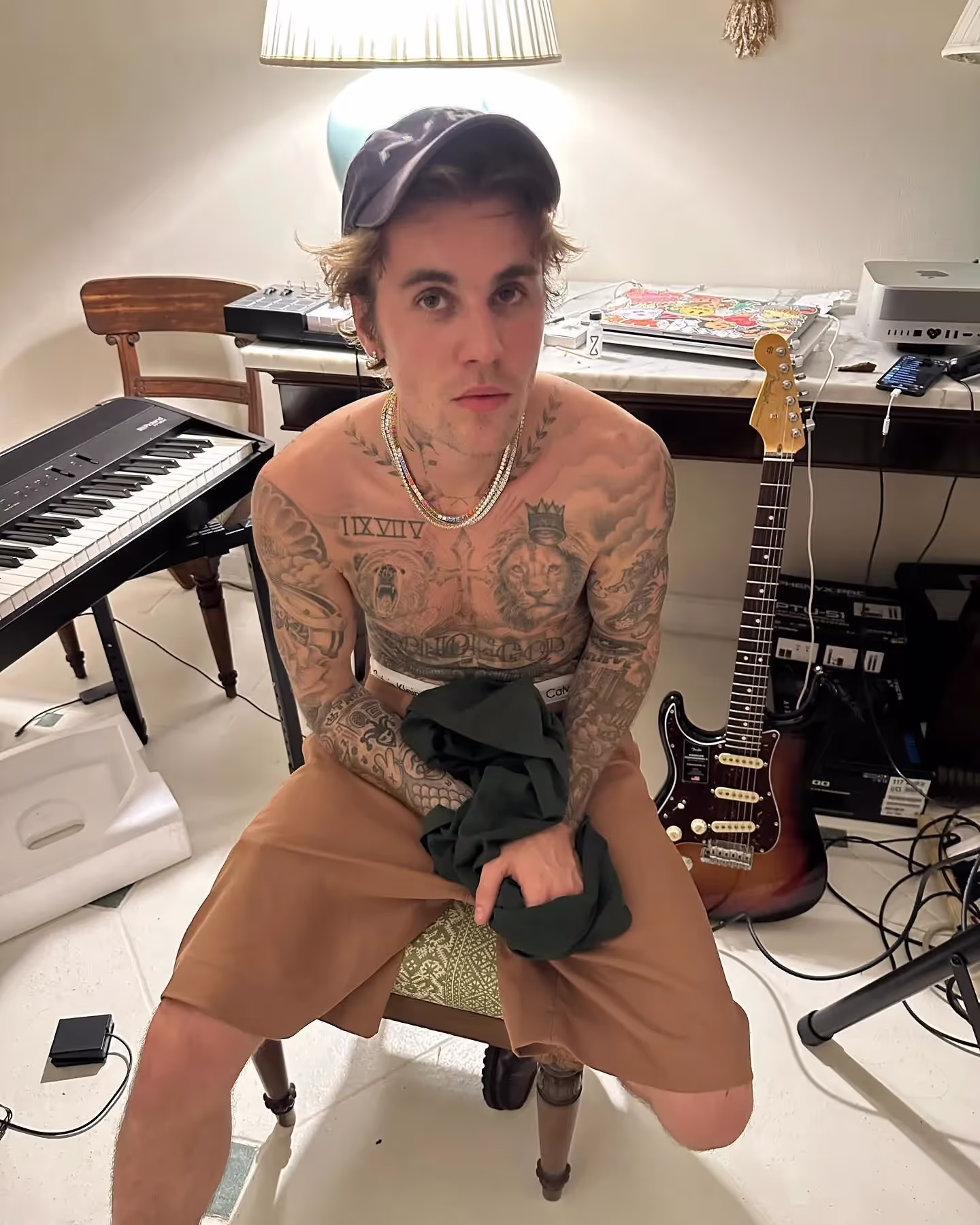Justin Bieber shows off fit body and ink in a new image working in a studio