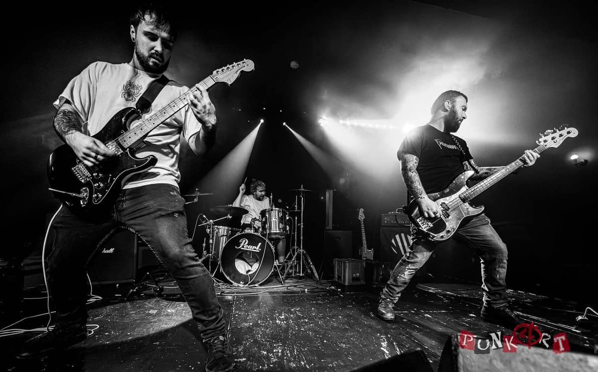 Around seven performing in stage, black and white