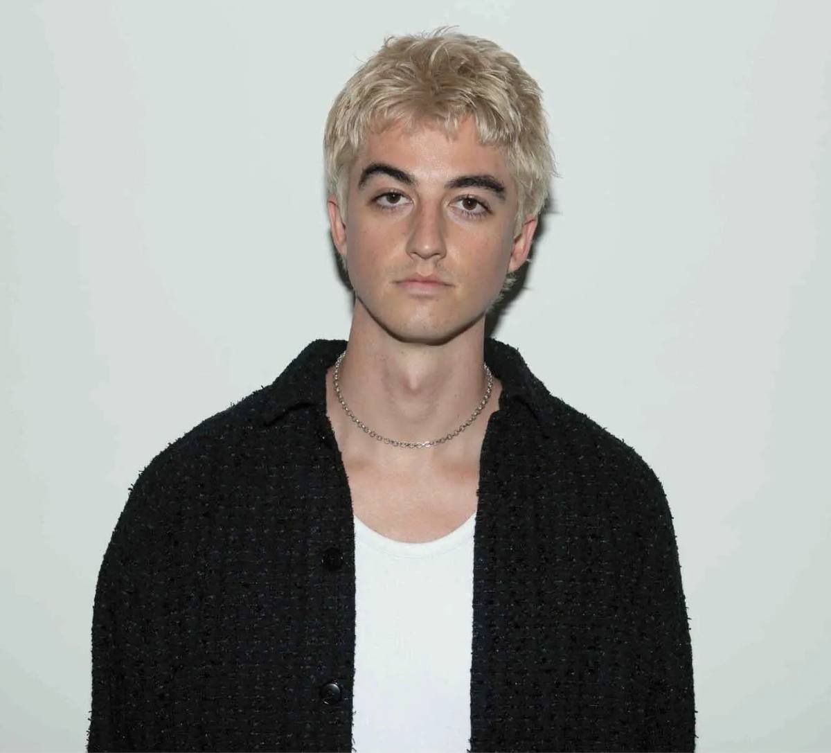Elijah Woods with blond hair, photographed against a white background. Photo credit: George Pimentel.