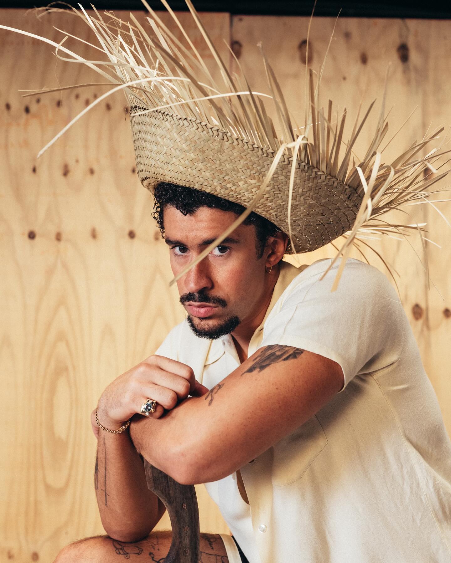 Bad Bunny in white t-shirt and straw hat, DeBÍ TiRAR MáS FOTos press kit, 2025