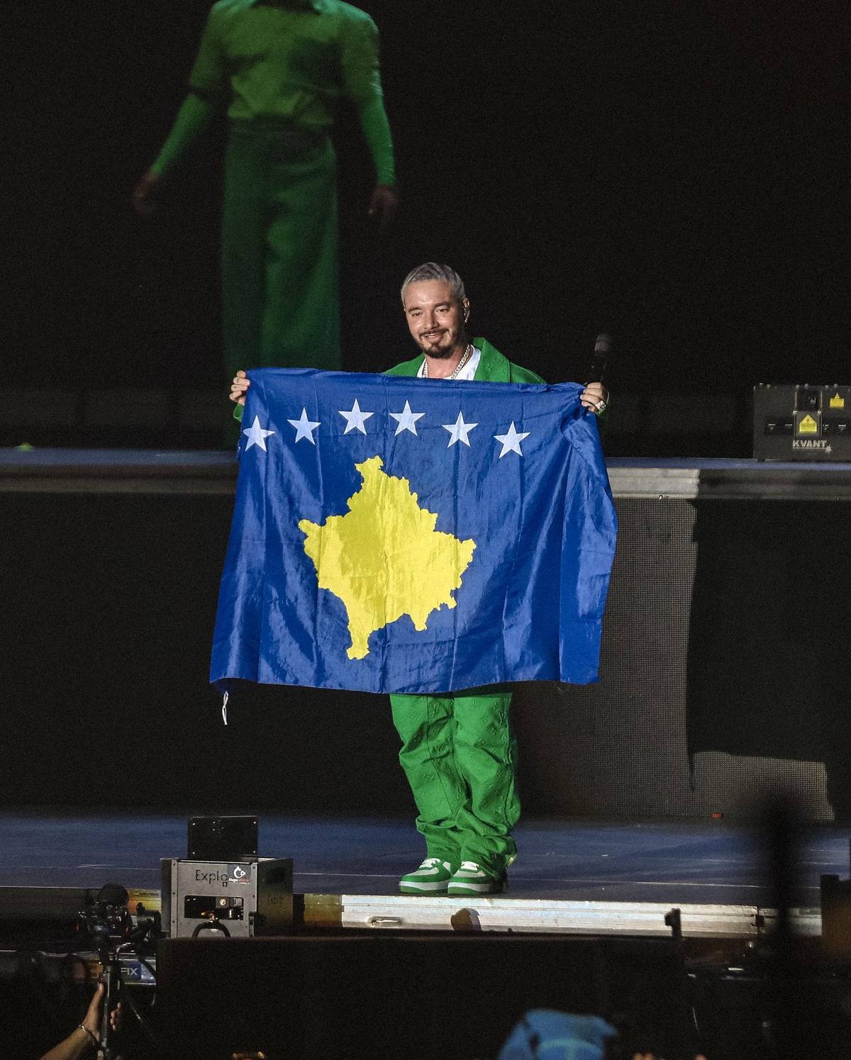 J Balvin on the stage of Sunny Hill Festival holding flag of Kosovo, 2022